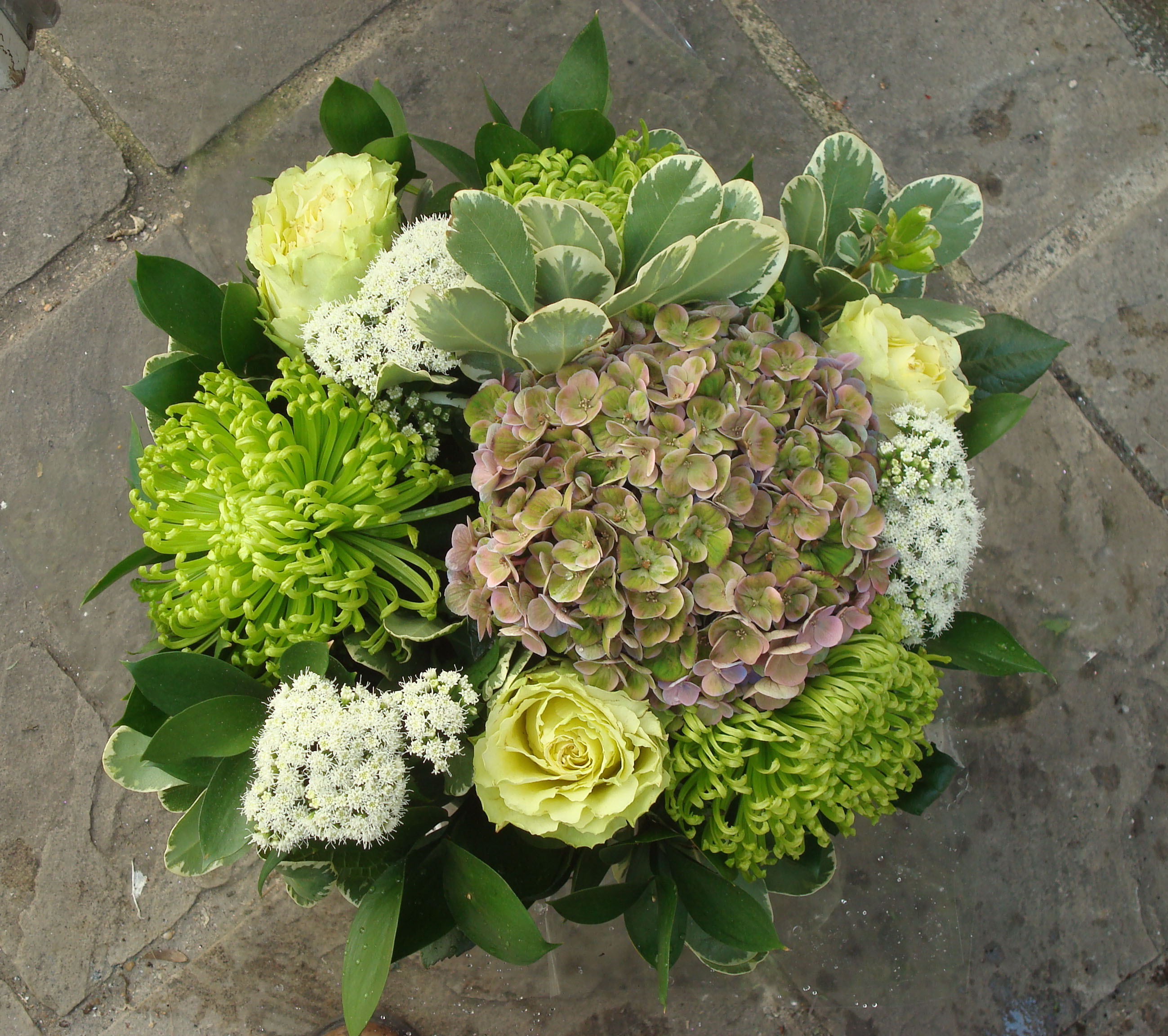 Fresh green bouquet crysanthemum viburnum and hydrangea yellow roses